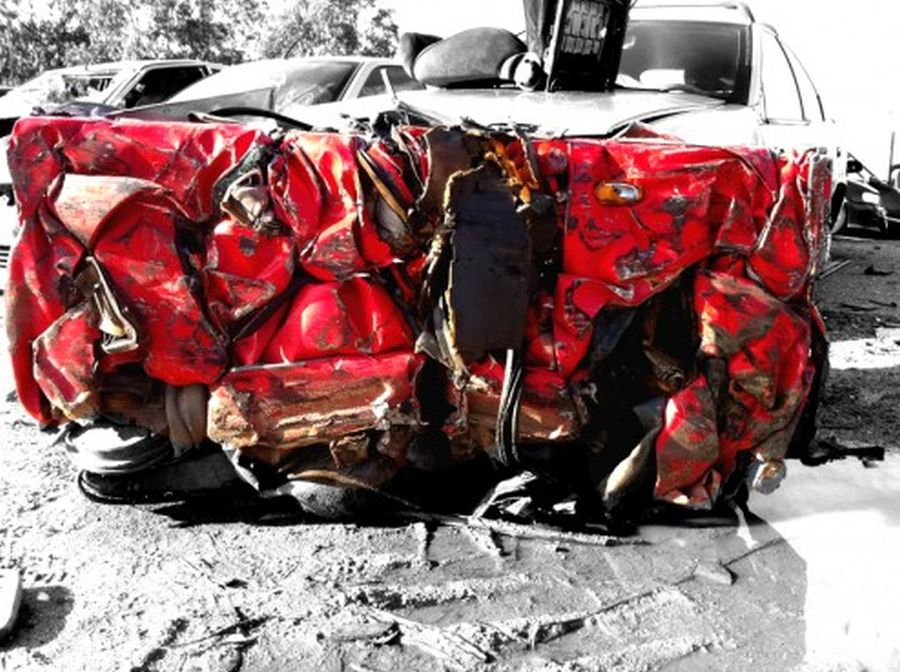 Charly-Molinelli-Crashed-Ferrari-Table-A-494x369